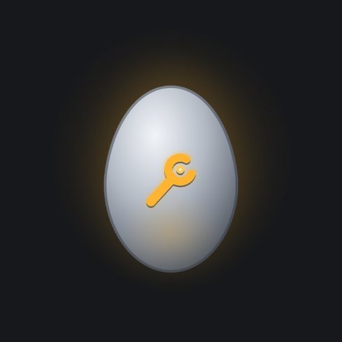 A palladium egg with an open-end wrench inlaid in amber.